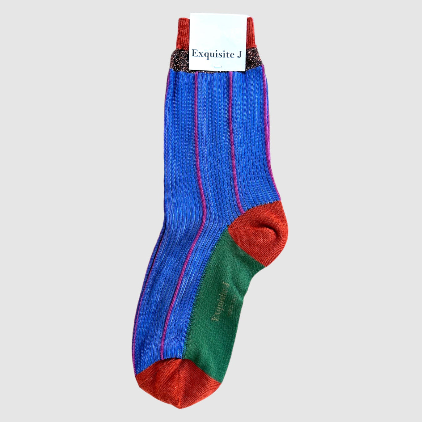 Colorful sock with red, blue, and green on a light gray background
