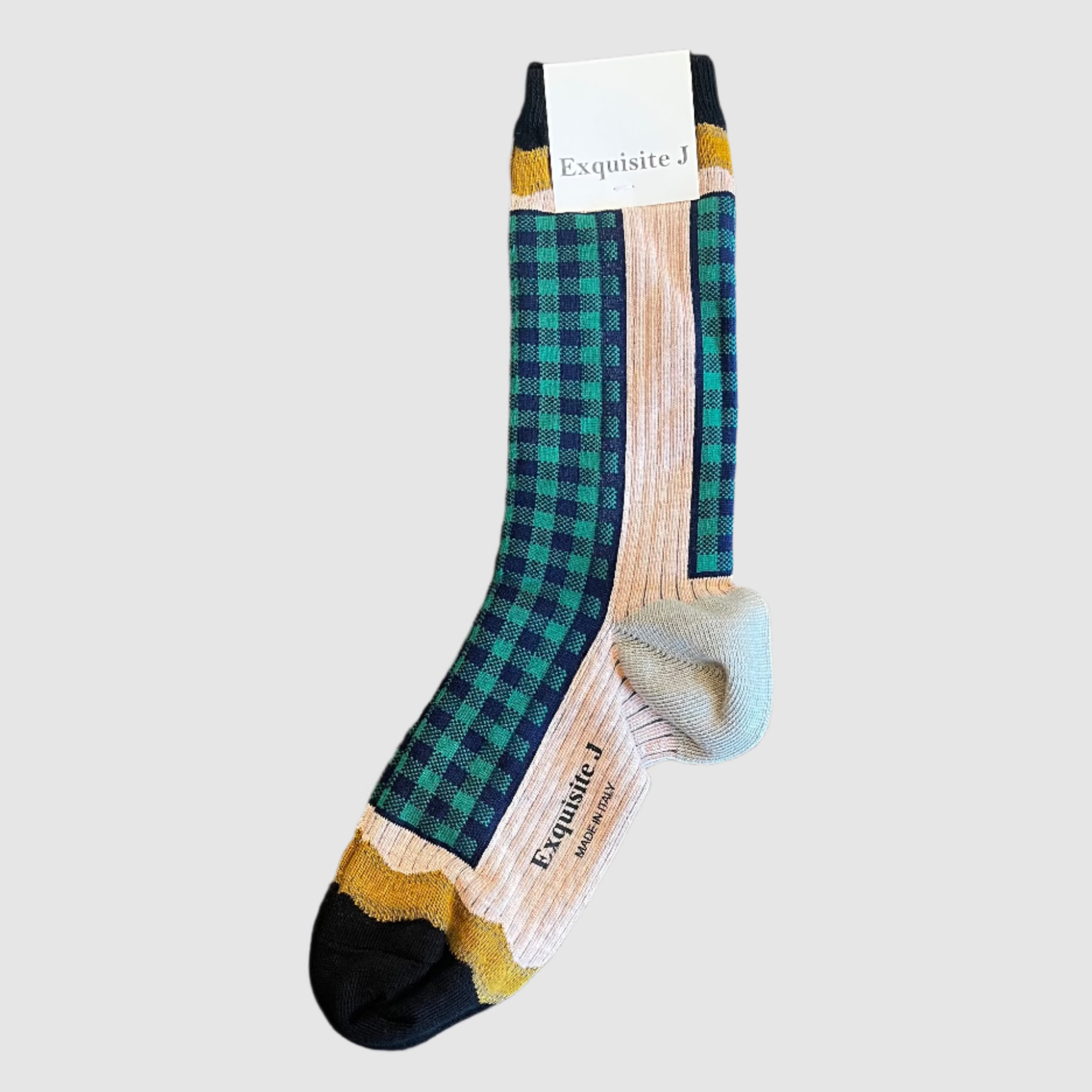 Plaid sock with brand label on a light grey background