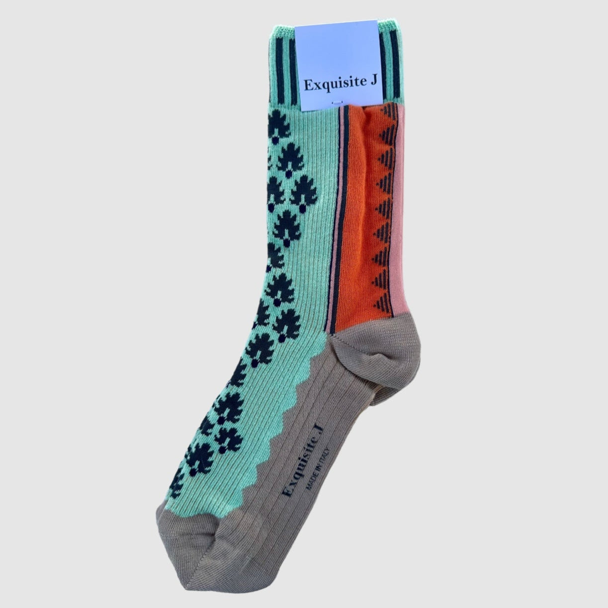A pair of patterned cotton socks with teal, black, tomato grey footbed, and pink stripe, displayed on a white background.
