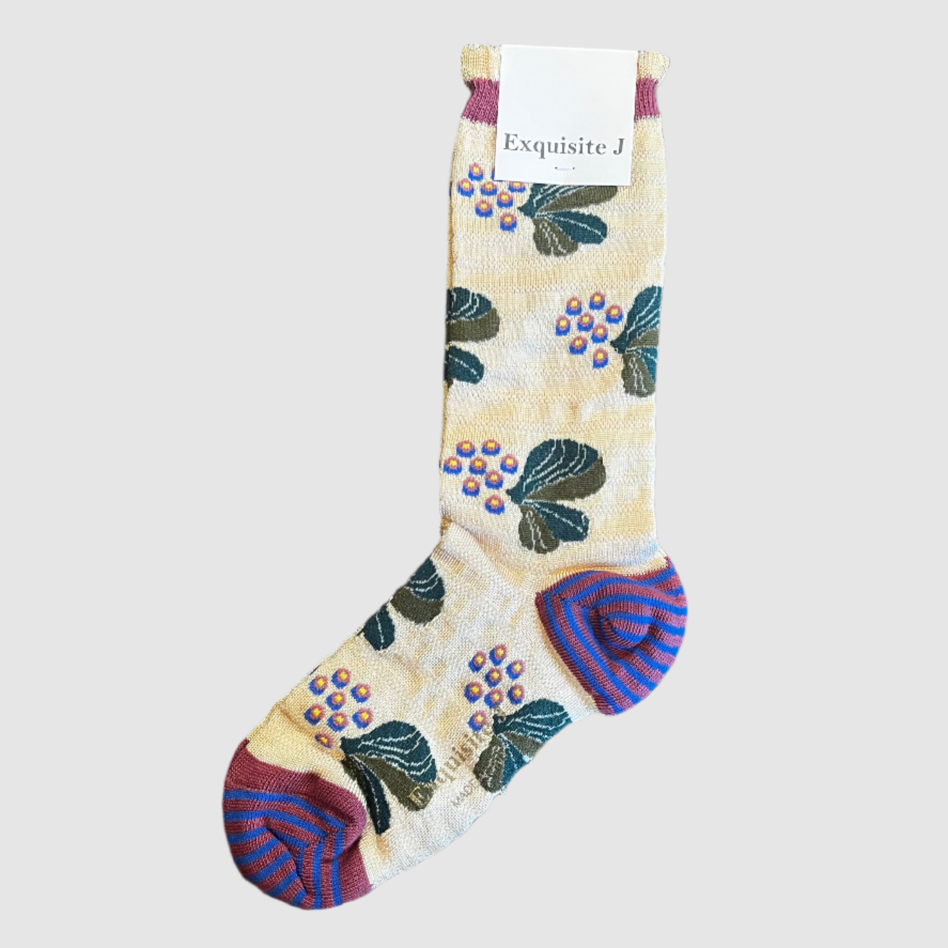 Decorative sock with floral patterns on a light grey background, branded 'Exquisite J'.