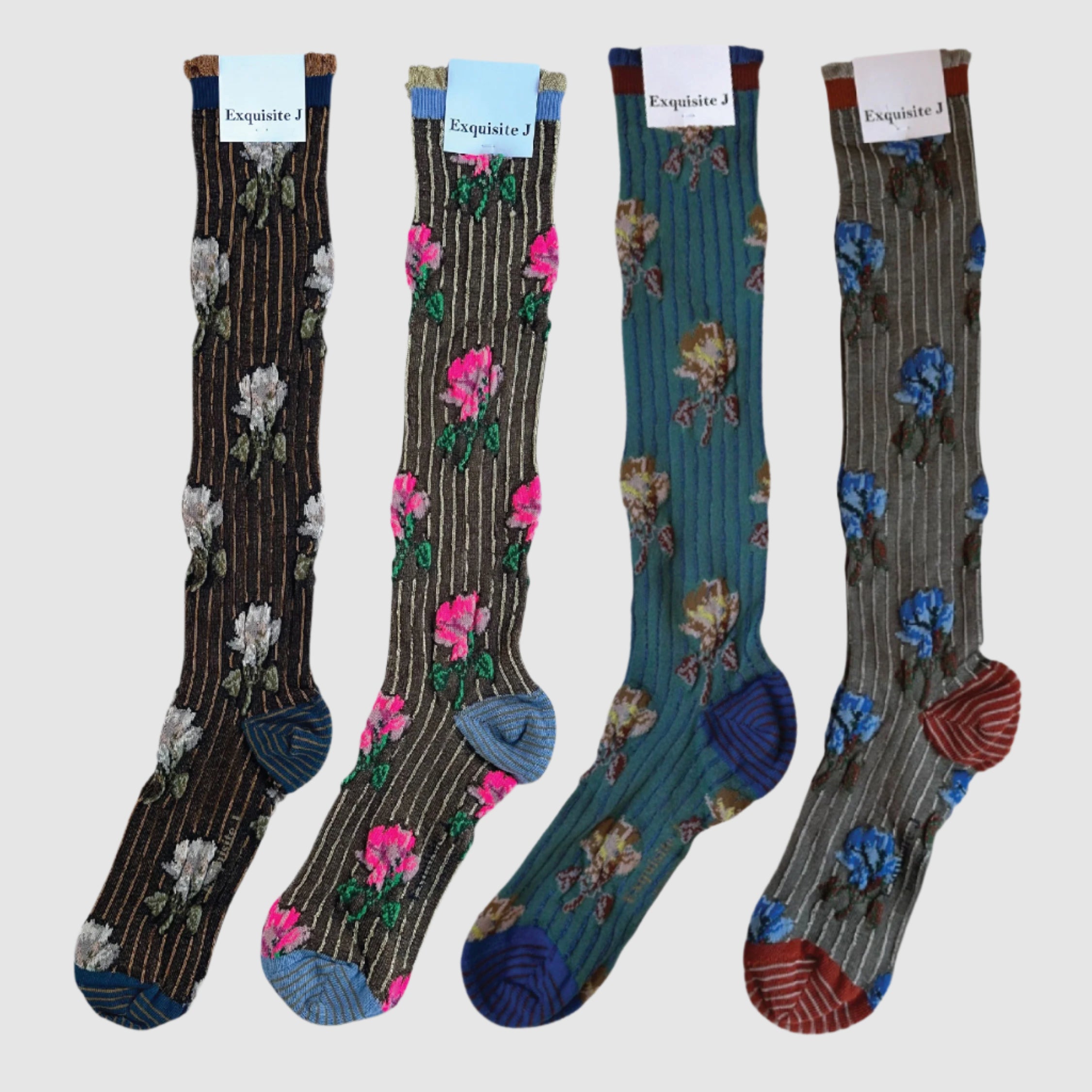 Four pairs of floral-patterned socks on a white background