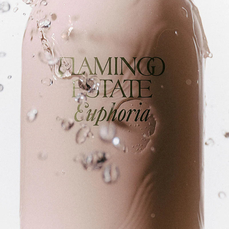 Product bottle with 'Flamingo Rotate Euphoria' text and logo on a light background