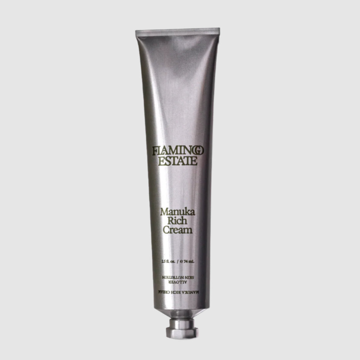 Silver tube of Flamingo Estate Manuka Rich Cream on a white background