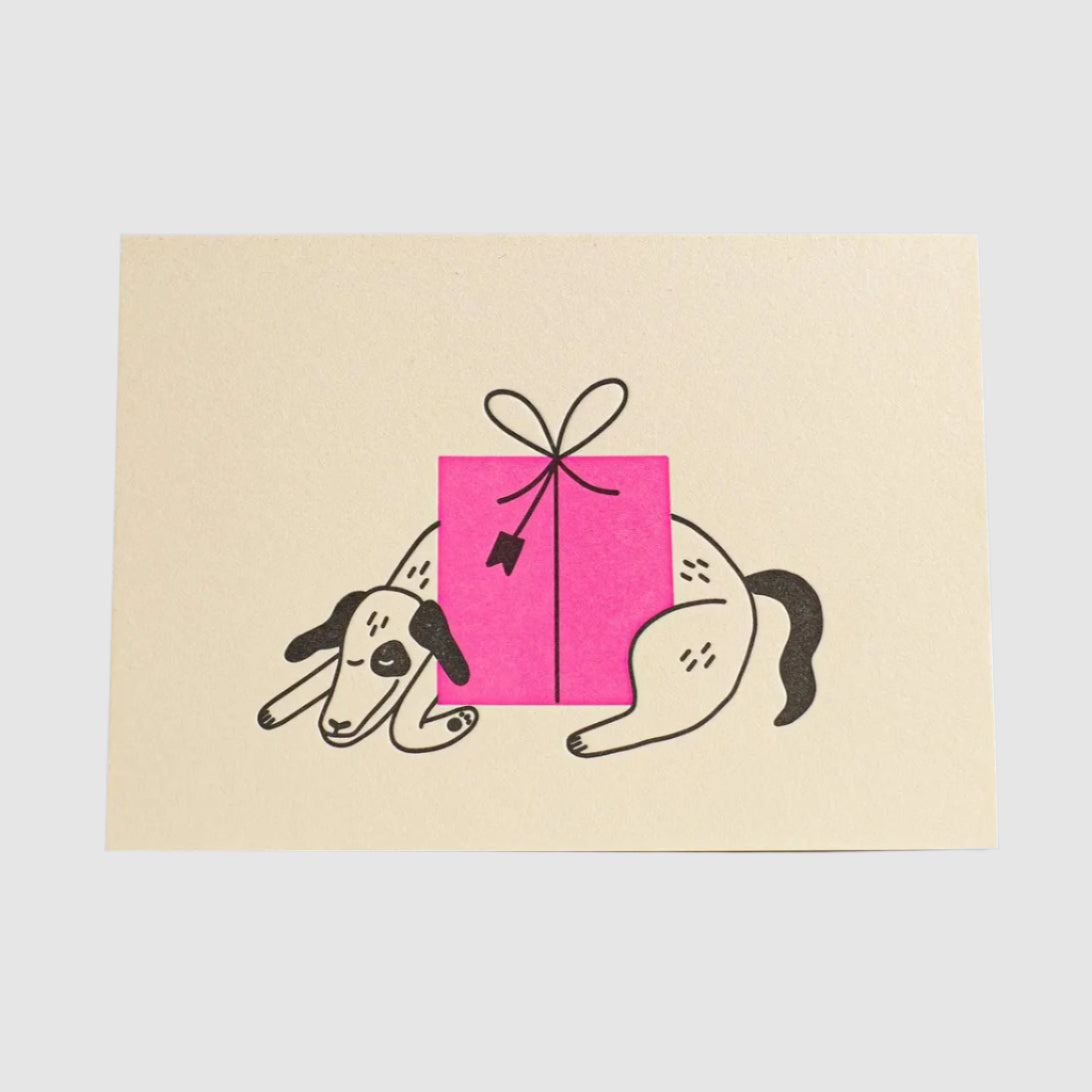 Card with dog illustration and pink gift box on a blue background