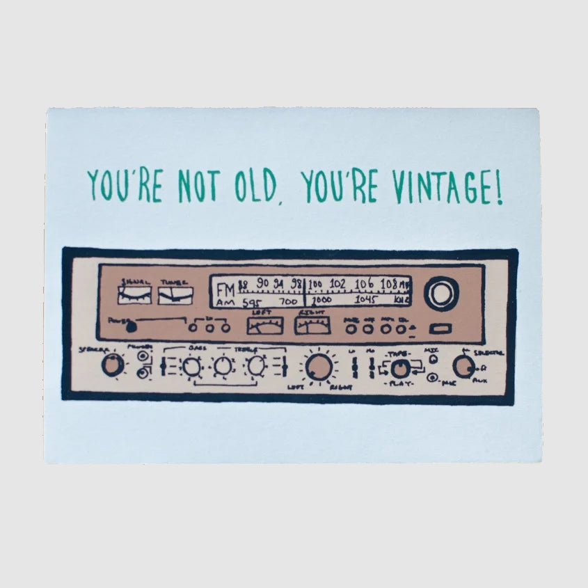 Card with vintage radio design and text 'You're not old, you're vintage!' on a light grey background.
