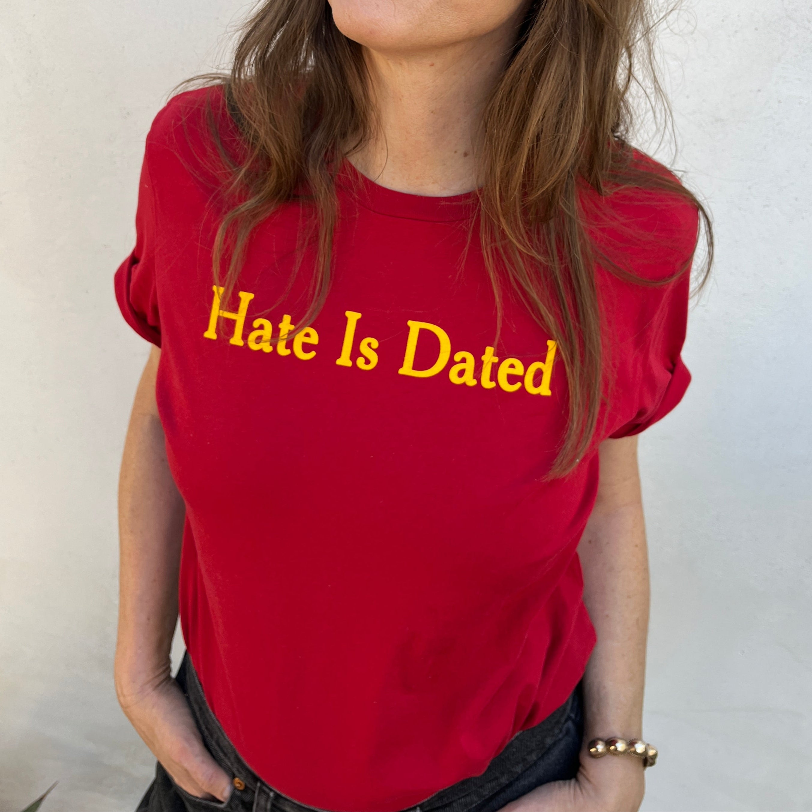 Mellow Dawn posed in a "Hate Is Dated" t-shirt 
