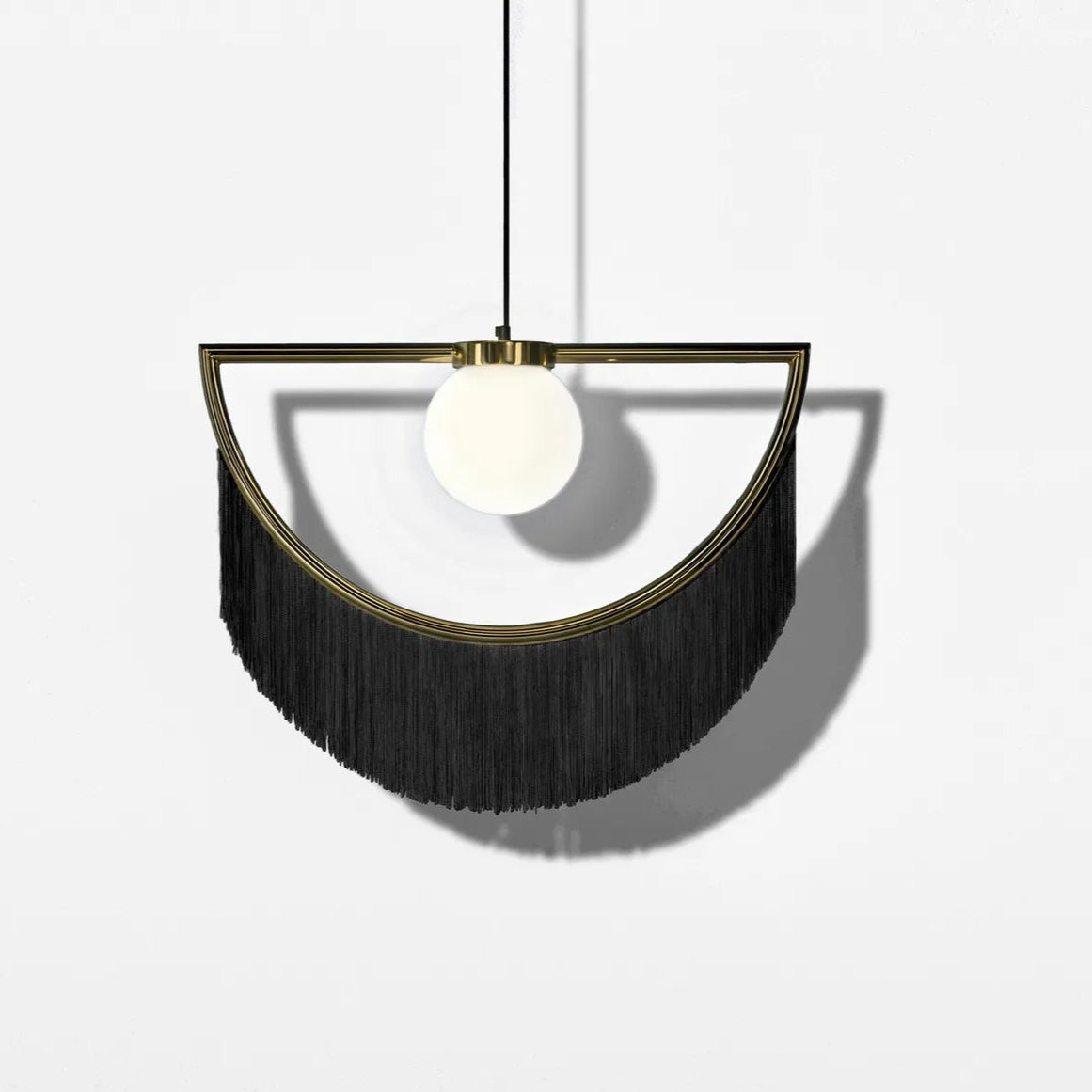 Modern pendant light with black fringe design on a white background