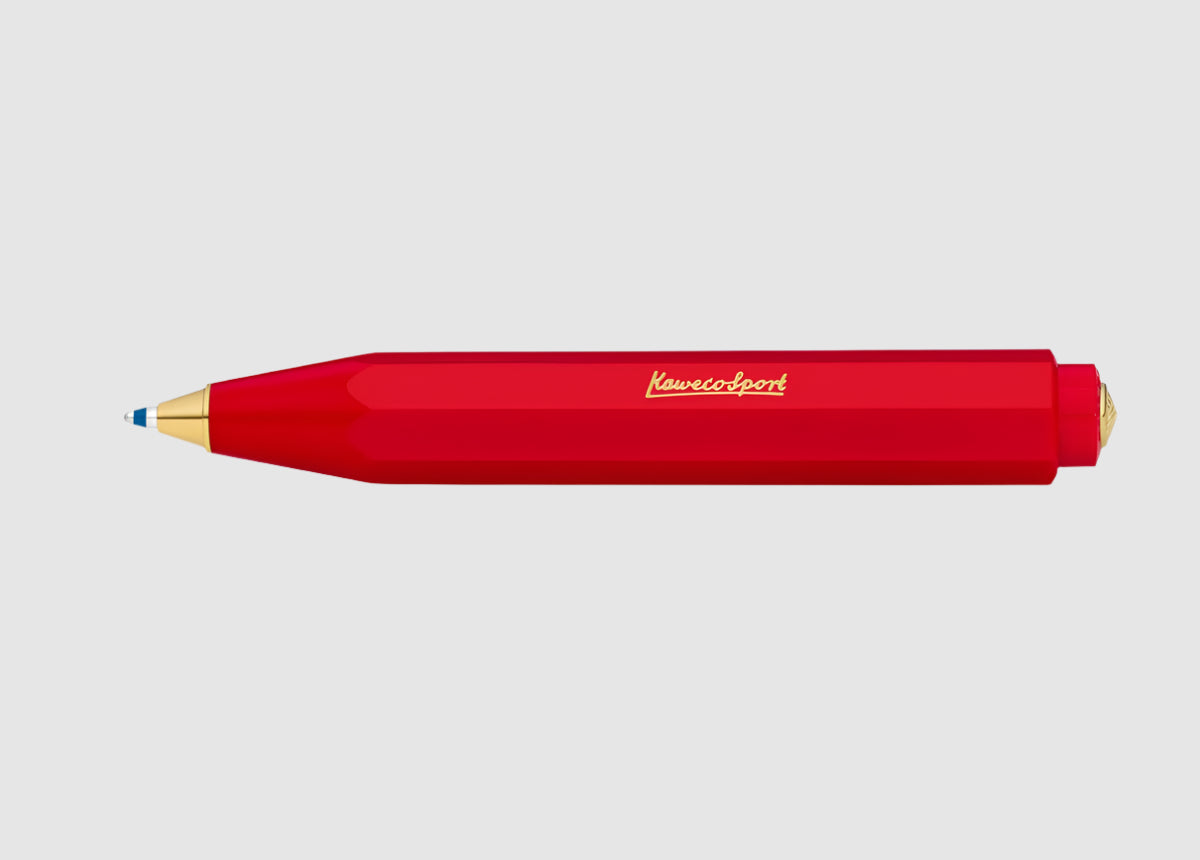 Red pen with gold accents on a white background