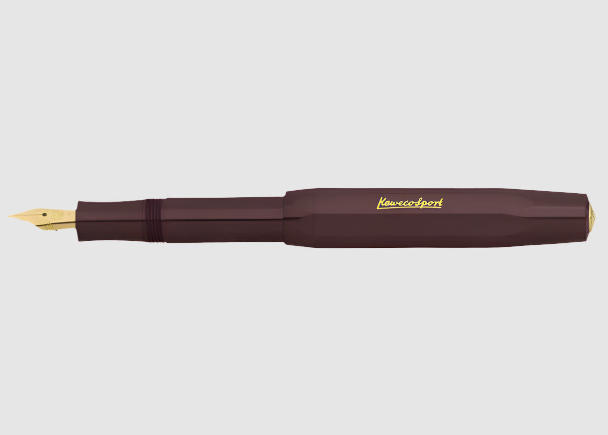 Maroon fountain pen with gold accents on a white background