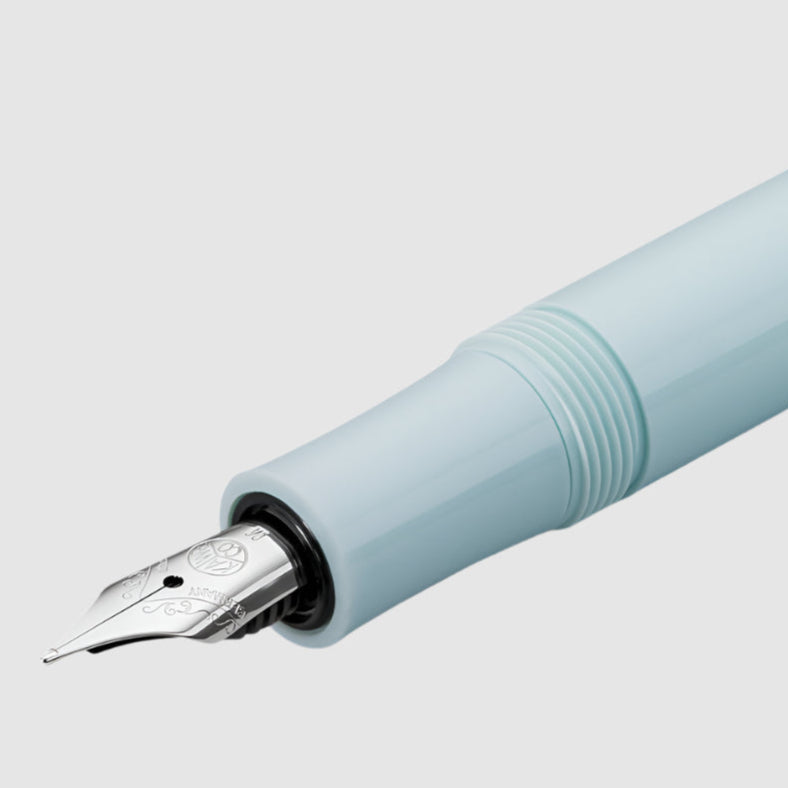 Light blue fountain pen on a white background