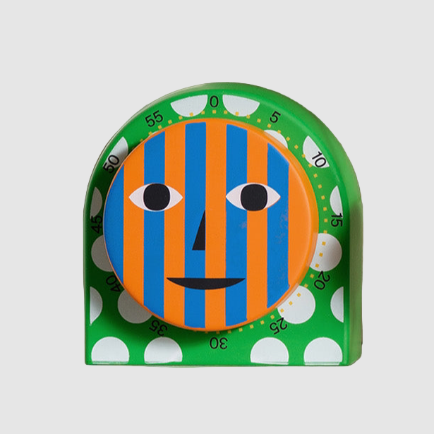 A colorful kitchen timer with a striped face design in orange and blue, with white polka dots, displayed on a white background