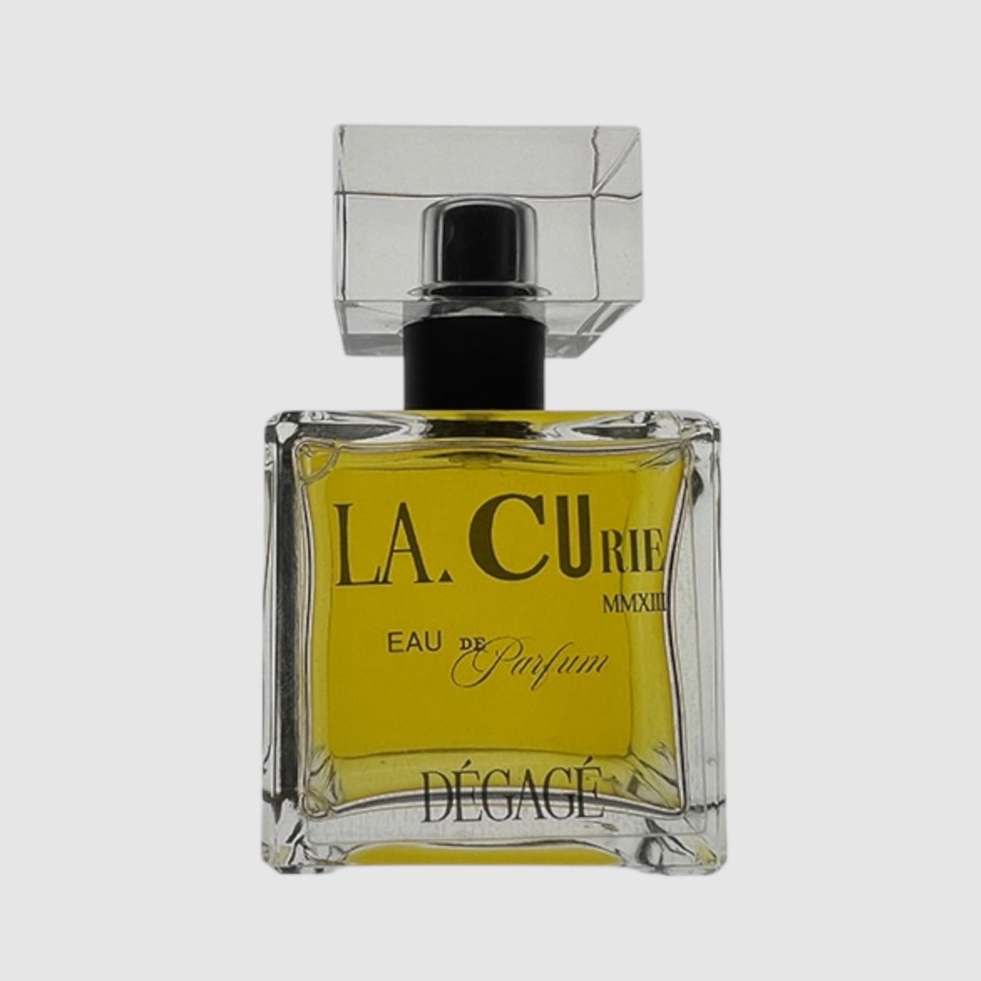 A square glass bottle of LA CURIE Eau de Parfum with a black cap, labeled 'DéGAGE'.