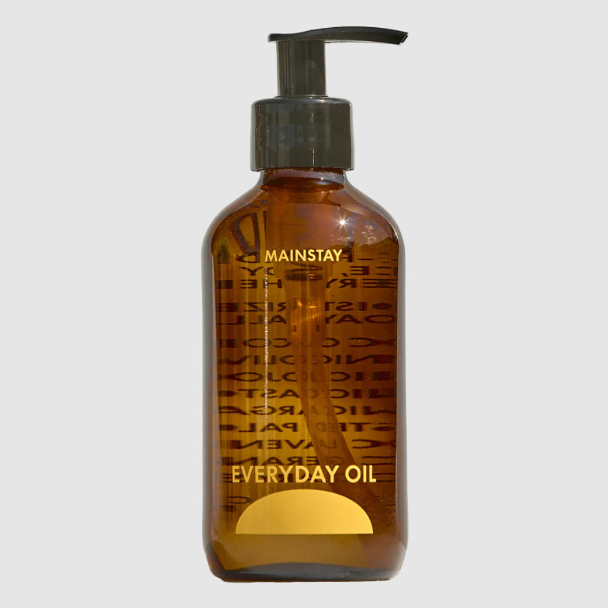 Brown bottle labeled 'Everyday Oil' with pump on a white background