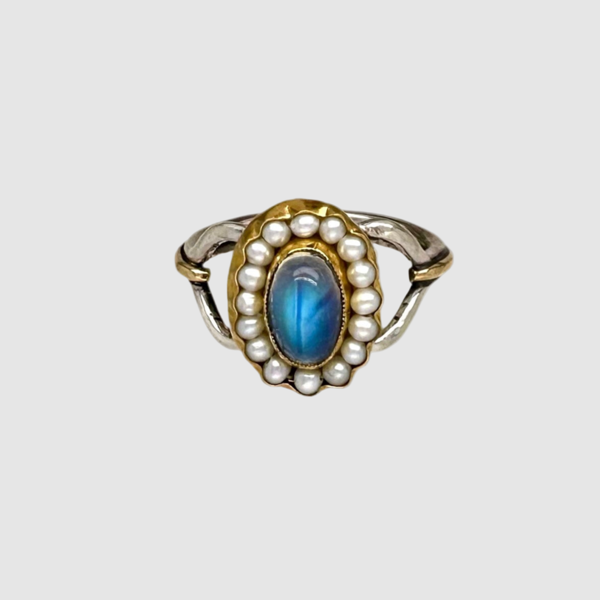 (e6e6e6 background. focal point selected) short description of ring including materials, gemstones, size, etc then "on a light grey background". Then - - this ring is designed and handmade in Tucson, Arizona by Sofie Albertsen / Tasha Bundy