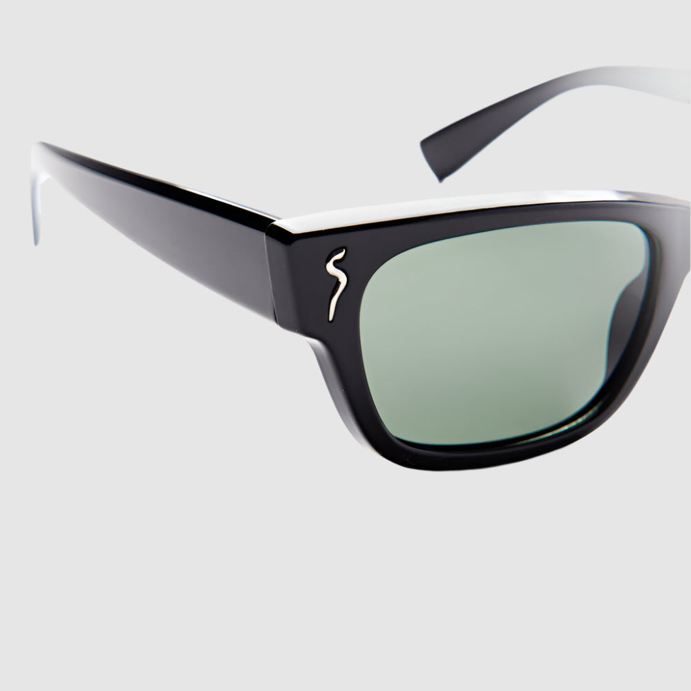 Close-up, angled front view of black, 'Subterrannean homesick' style, Shady Spex sunglasses on a light grey background. 