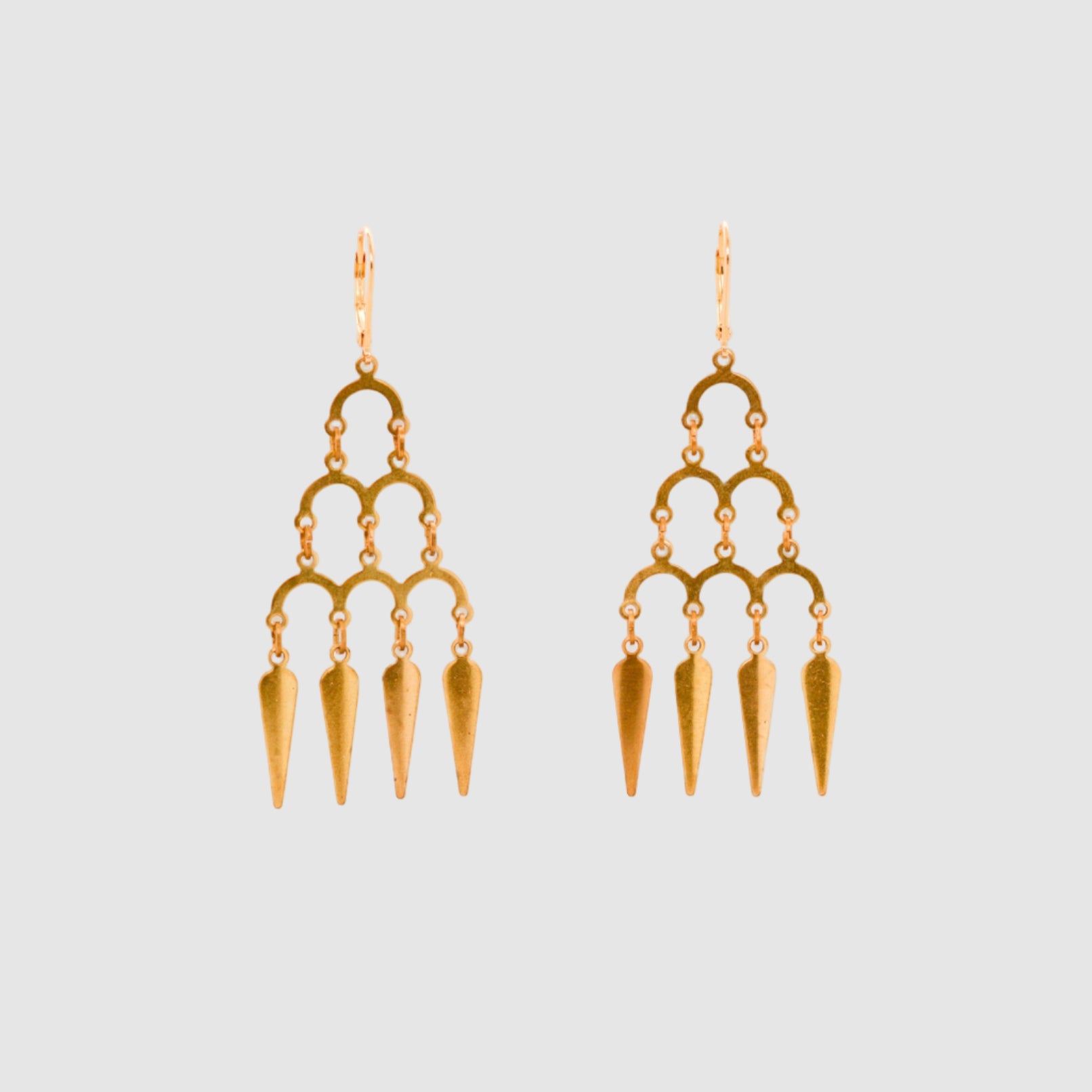 (e6e6e6 background. EARRING PAIR/ PLAIN, focal point selected) short description of earrings including materials, length, clasp type etc then "on a light grey background". Then - - these earrings are designed and handmade in Tucson, Arizona by Sofie Albertsen / Tasha Bundy