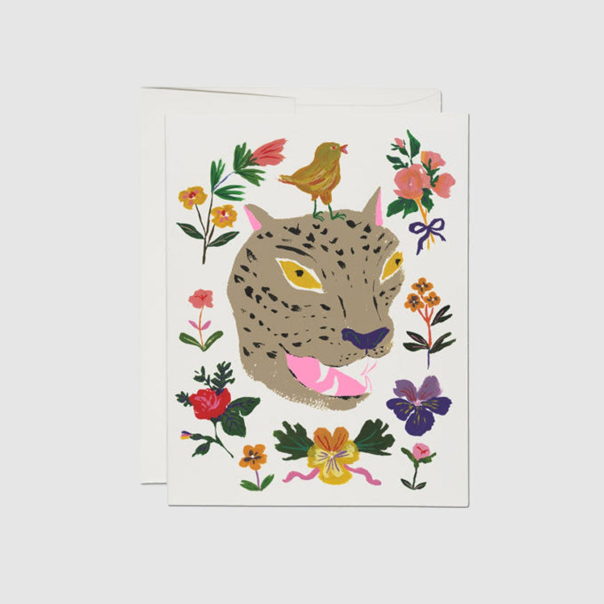 Front view of a red cap greeting card with colorful illustrations of flowers, a bird, and the head of a leopard.